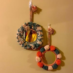 two small hanging boho mirrors